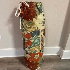 Large yoga mat bag with one large zippered pocket and one small.